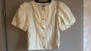 Statement top met pofmouwen beige